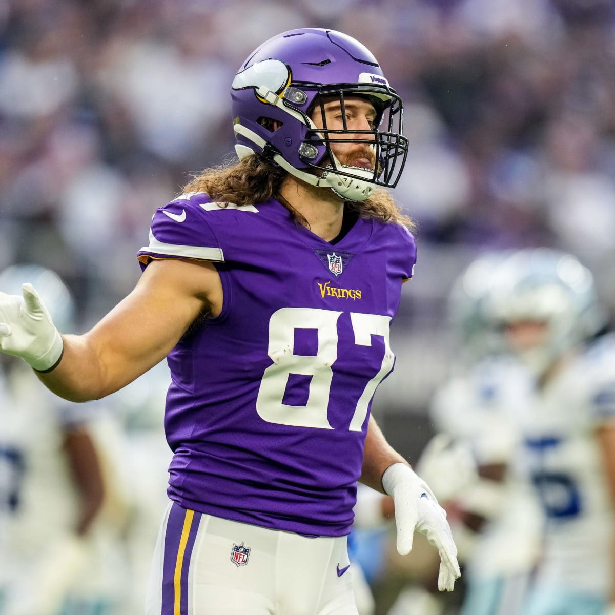 Minnesota Vikings tight end T.J. Hockenson (87) running with the ball  before the start of an