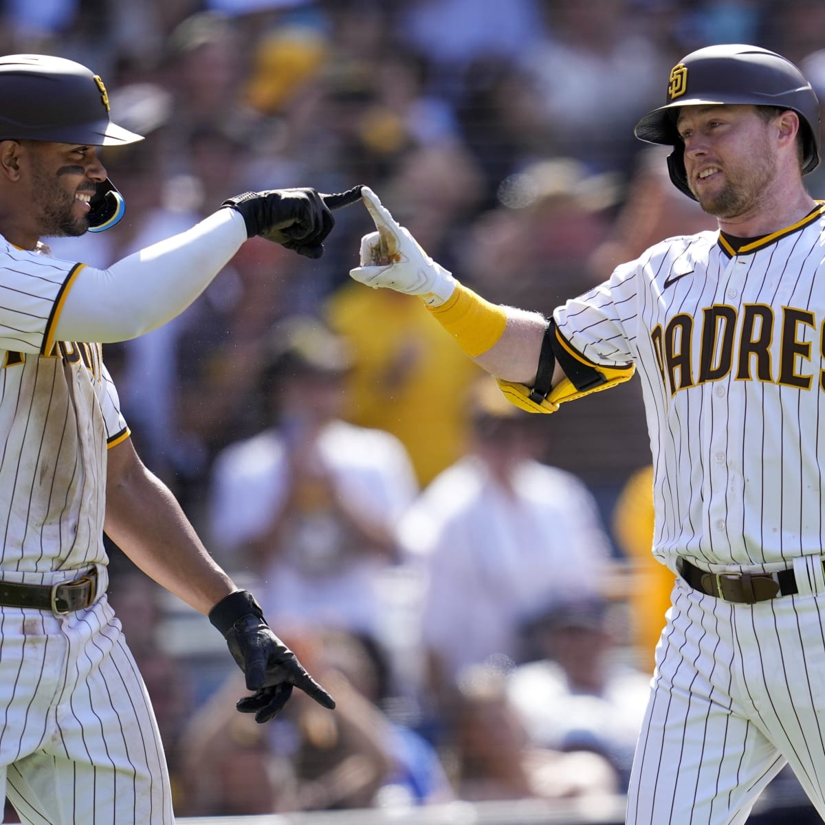 The San Diego Padres' Manny Machado is congratulated by teammate Rougned  Odor after he hit a