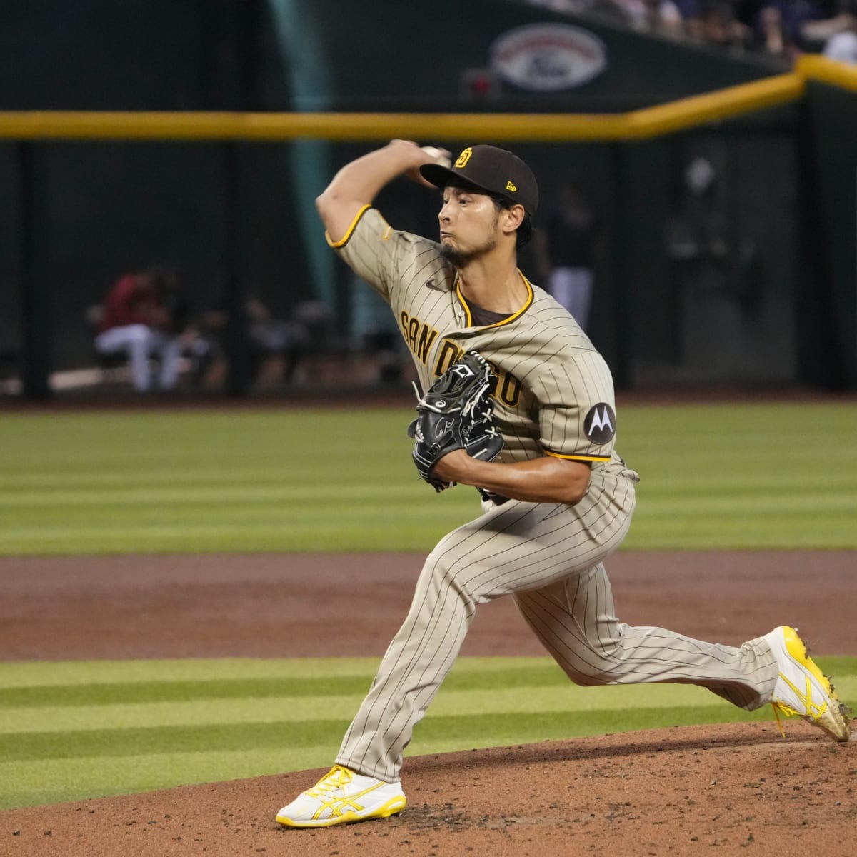 San Diego Padres starting pitcher Yu Darvish, left, leaves the