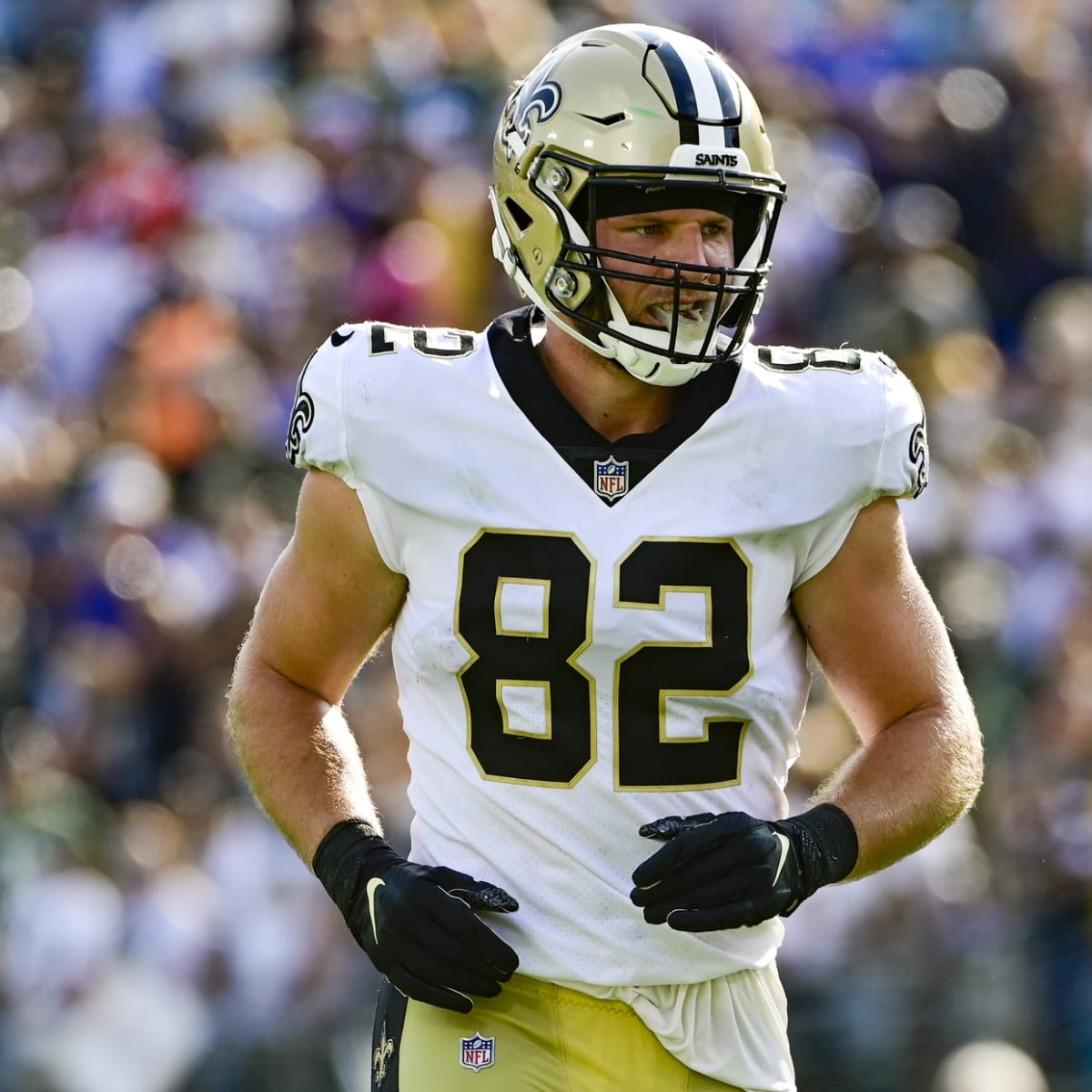 New Orleans Saints tight end Adam Trautman (82) wears a Salute to Service  towel during an NFL football game against the Los Angeles Rams, Sunday,  Nov. 20, 2022, in New Orleans. (AP