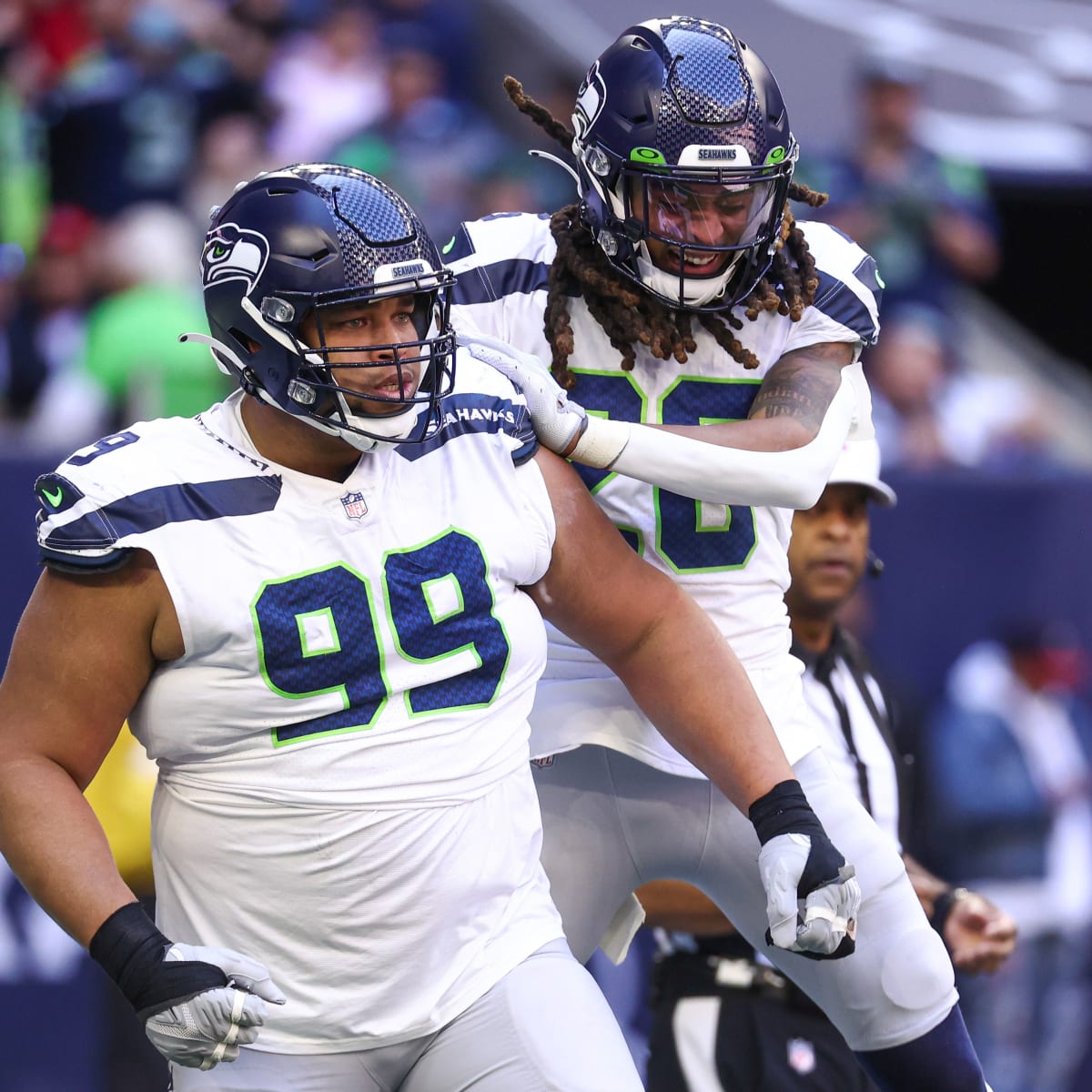 Seattle Seahawks defensive lineman Al Woods (99) celebrates after