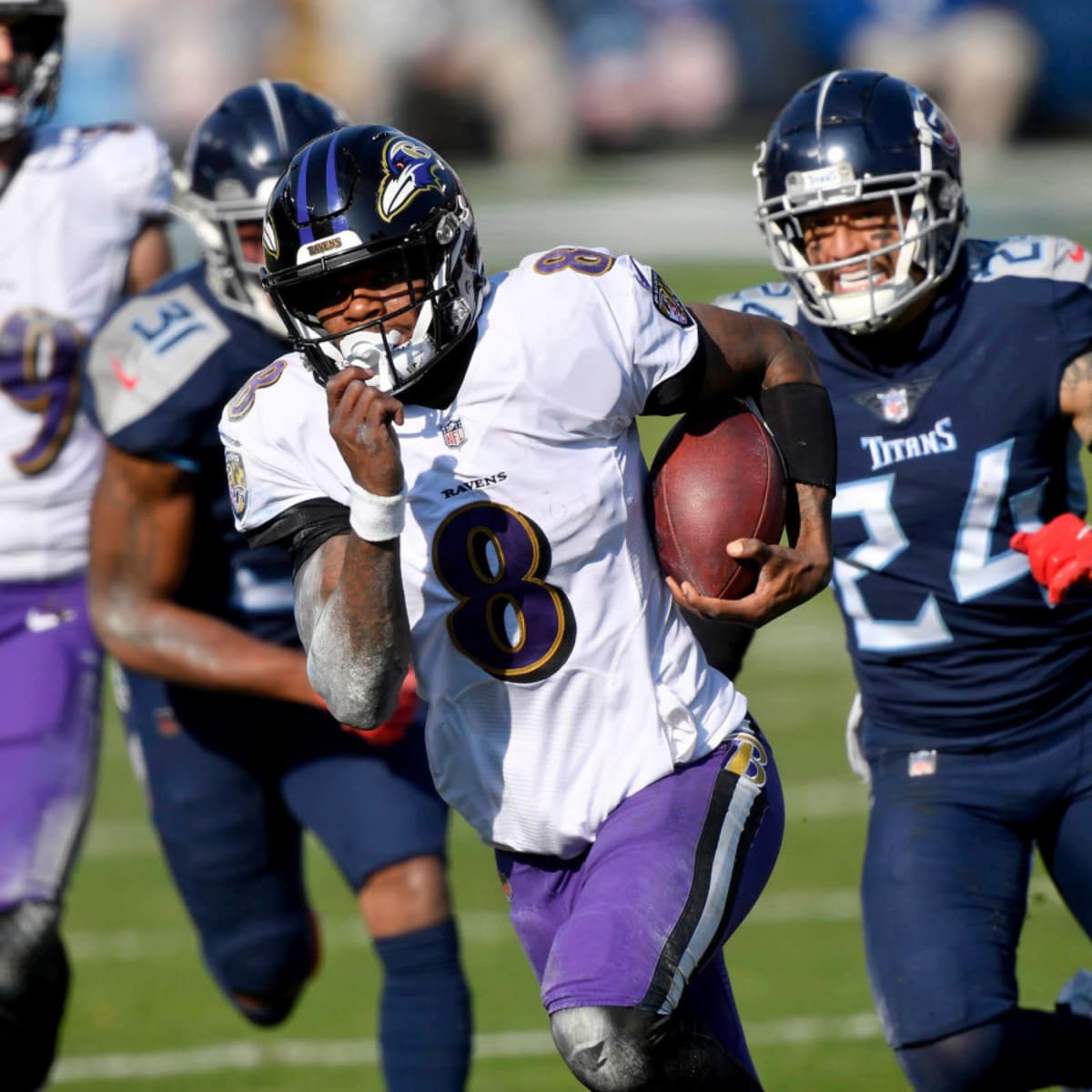 Baltimore Ravens quarterback Lamar Jackson sits on the bench as the Ravens  playoff hopes fade in the fourth quarter against the Tennesse Titans in the  AFC Division Playoffs at M&T Bank Stadium