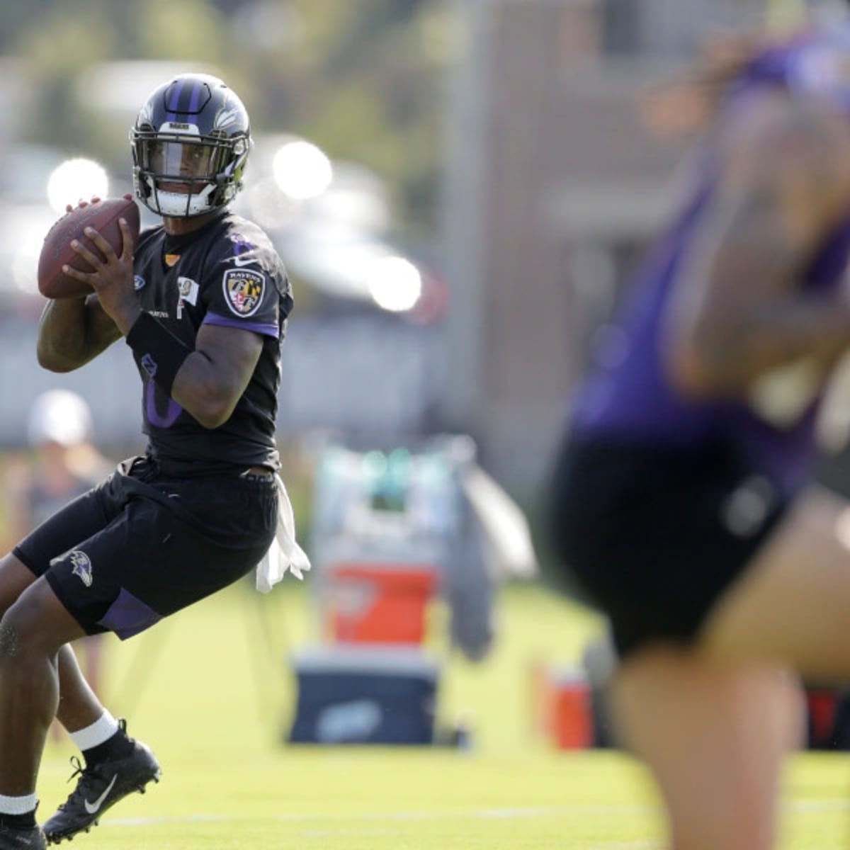 Lamar ditches wristband at camp as new Ravens OC preaches communication