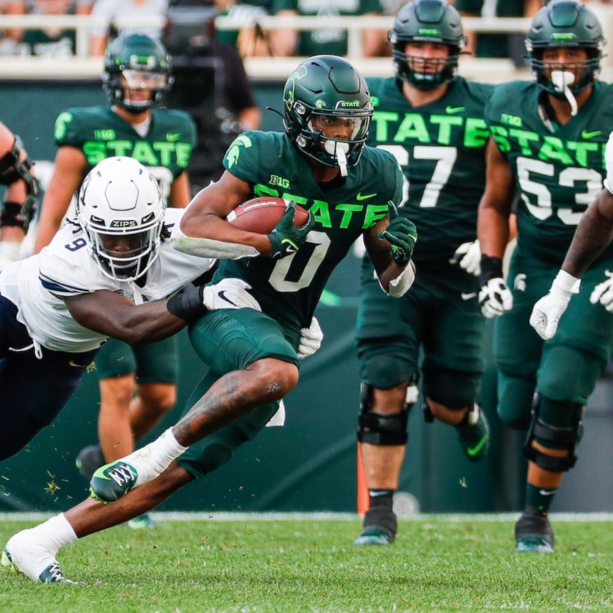 MIchigan State football glows with neon uniforms vs. Western Michigan