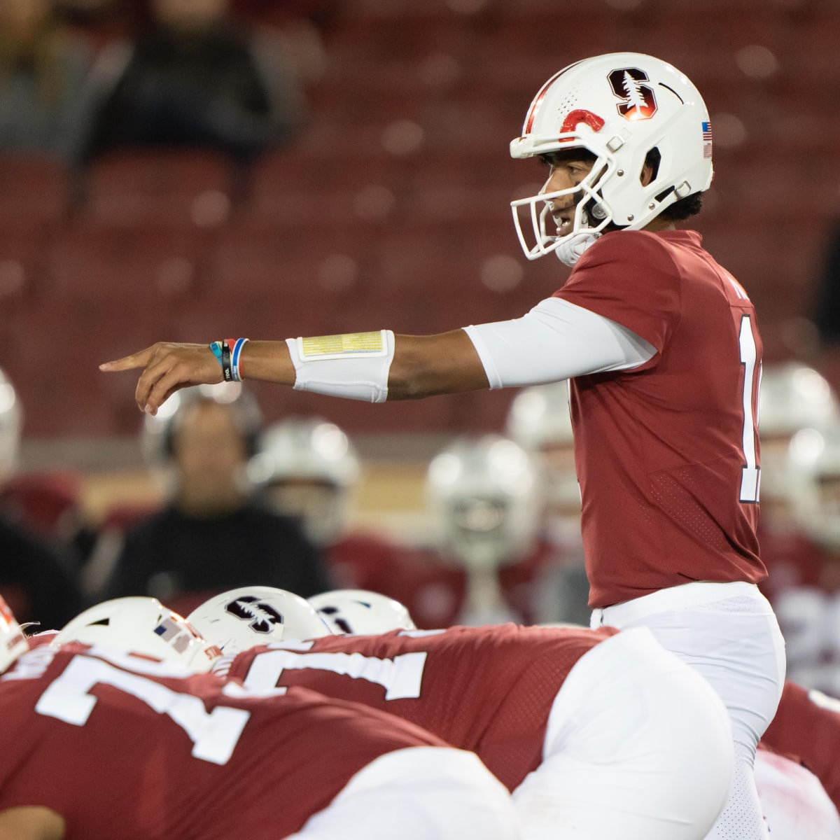 Christian McCaffrey of the Stanford Cardinal battles with Darrien