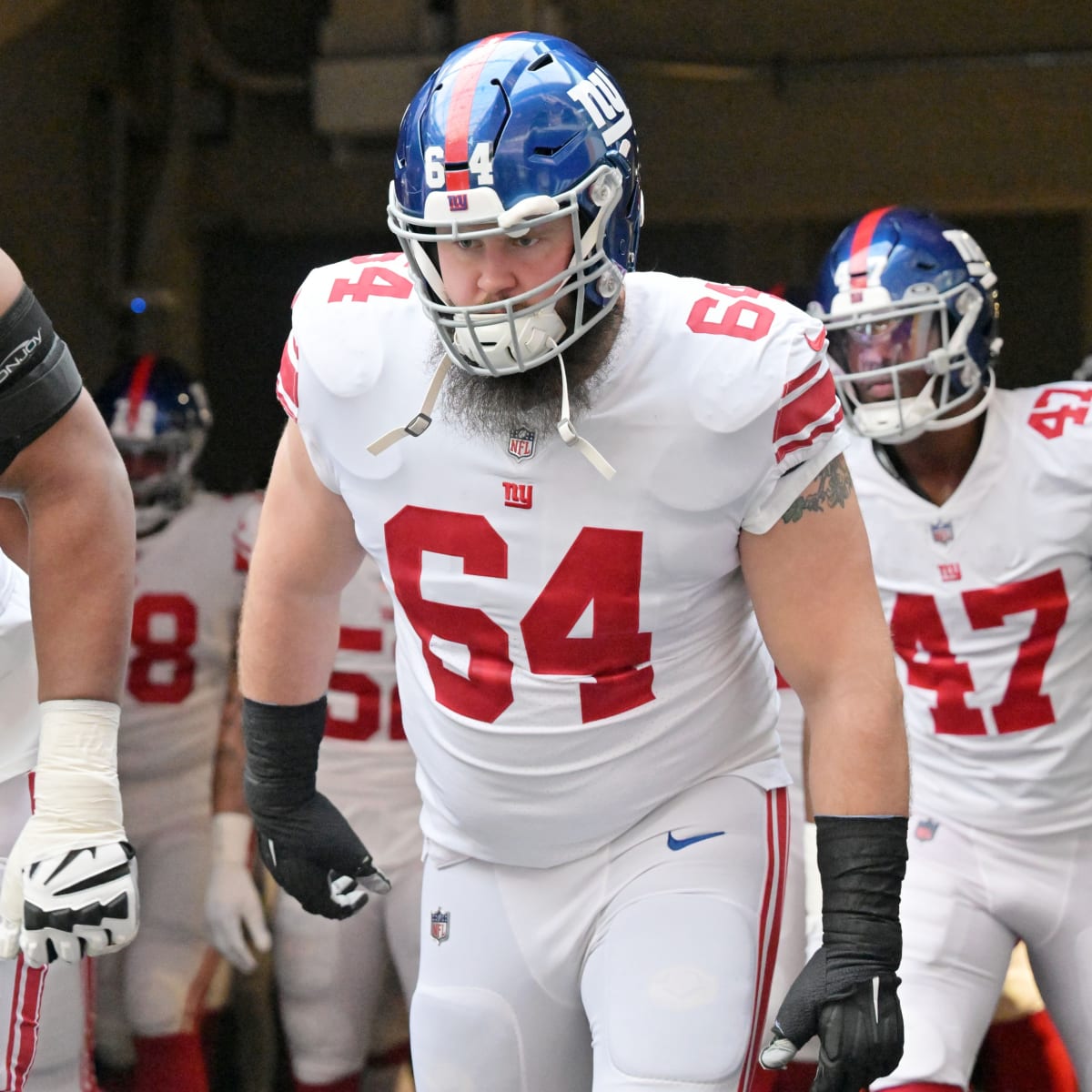 New York Giants guard Mark Glowinski (64) walks off the field