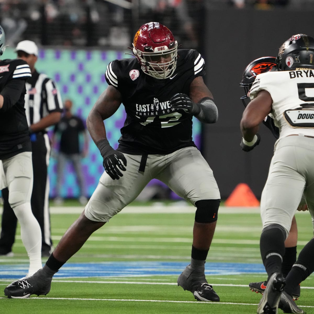 Seattle Seahawks tackle Jalen McKenzie (76) walks on the field