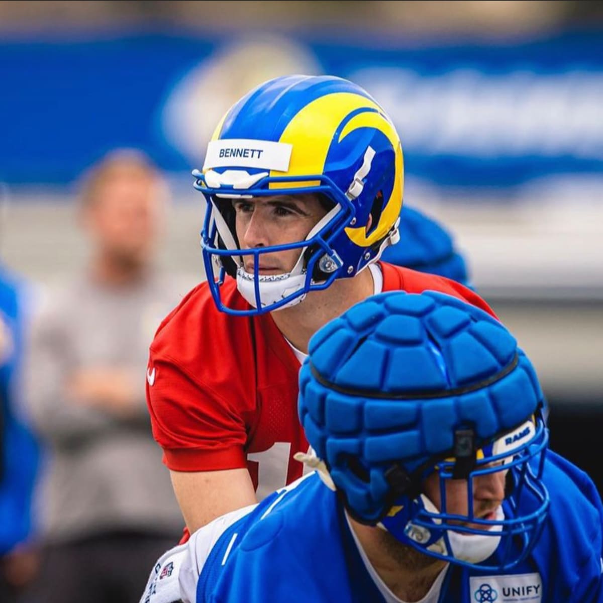 Quarterback Stetson Bennett of the Los Angeles Rams hands the ball News  Photo - Getty Images