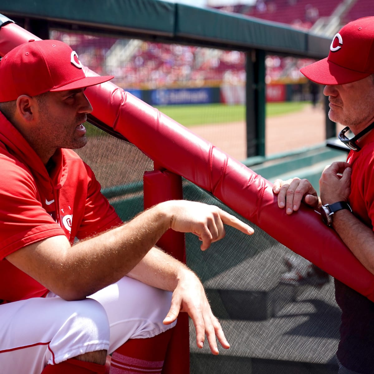 Cincinnati Reds' Joey Votto walks onto the field with his gear prior to a spring  training baseball game against the Chicago Cubs Saturday, March 27, 2021,  in Goodyear, Ariz. (AP Photo/Ross D.