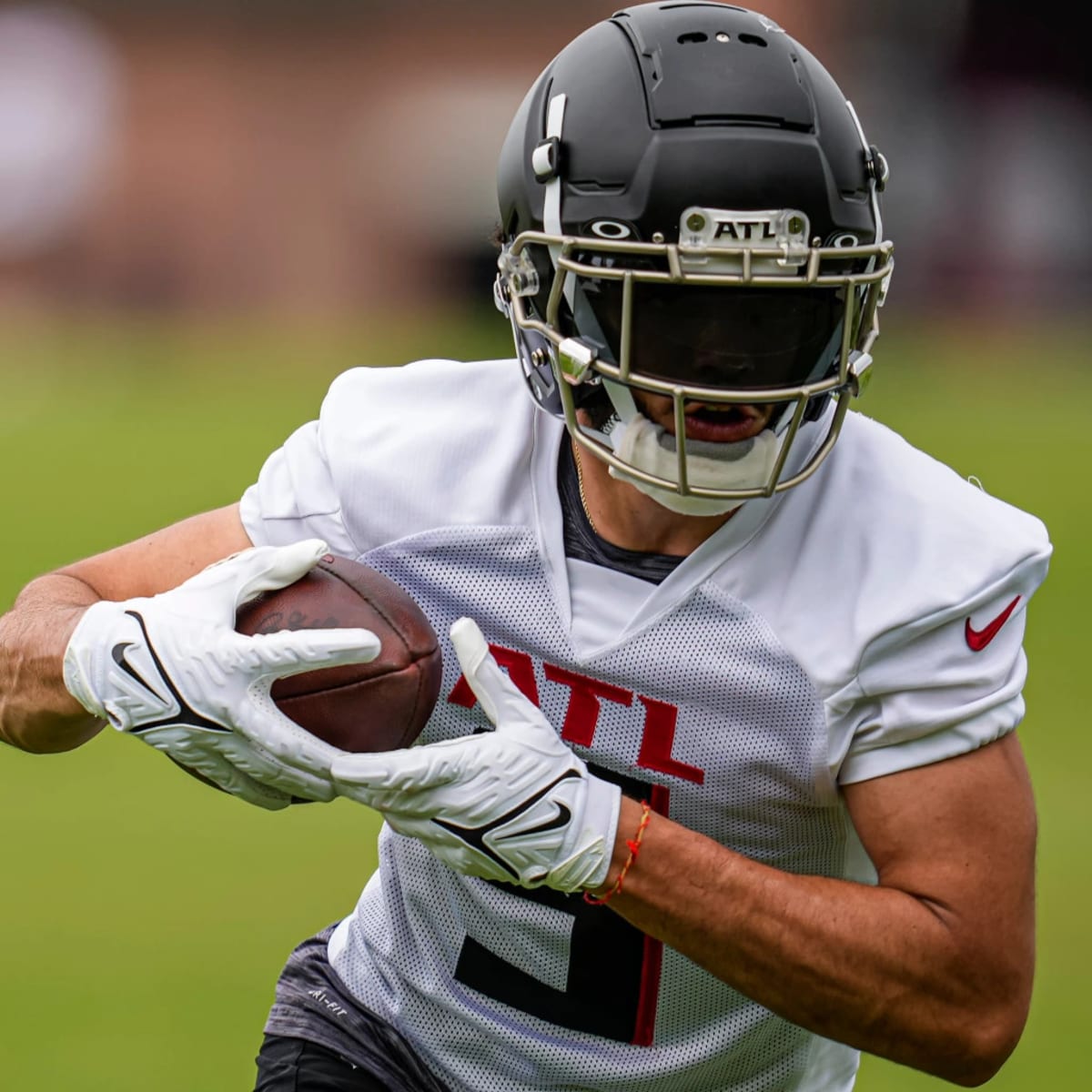 Atlanta Falcons wide receiver Drake London (5) walks off the field