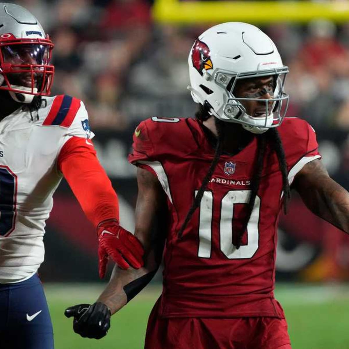 Free agent DeAndre Hopkins poses with Matthew Judon in Patriots locker room