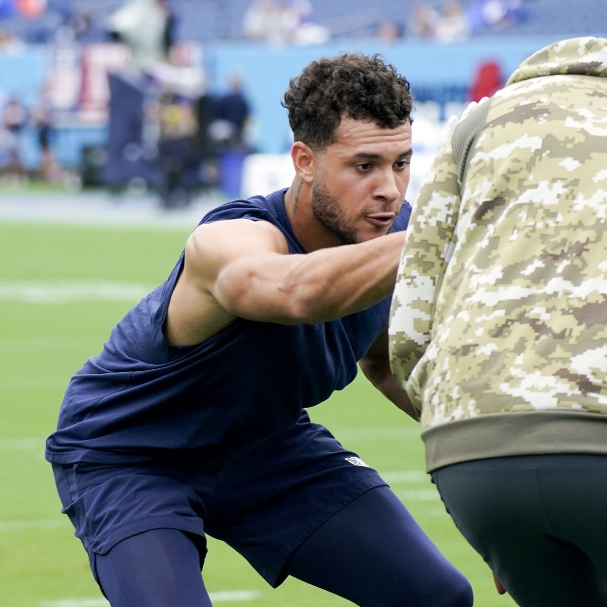 T-Rac, the Tennessee Titans mascot, poses for a picture with fans at a  training camp practice at the NFL football team's practice facility  Saturday, July 30, 2022, in Nashville, Tenn. (AP Photo/Mark