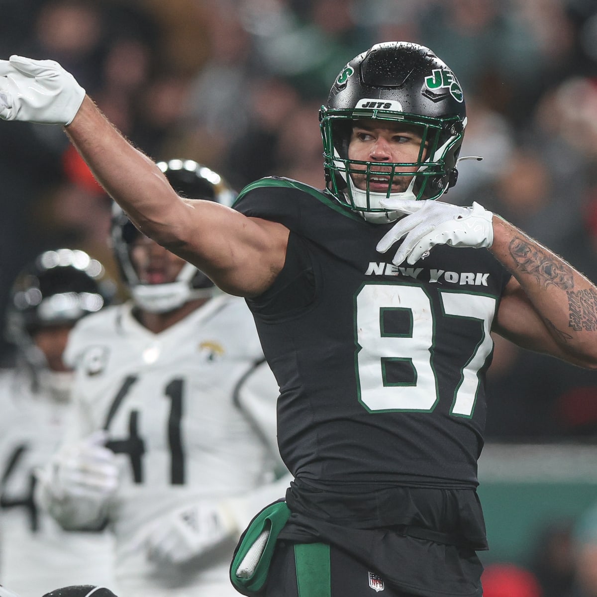 New York Jets tight end C.J. Uzomah (87) takes a moment before an NFL  football game against the Cincinnati Bengals, Sunday, Sept. 25, 2022, in  East Rutherford, N.J. The Cincinnati Bengals won