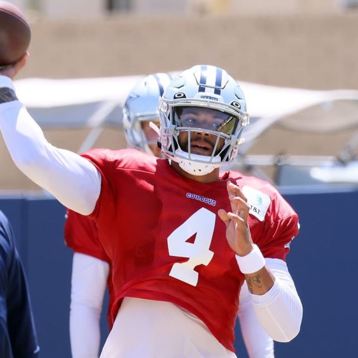 Dallas Cowboys quarterback Dak Prescott wears red as he lines up behind the  offensive line for a snap during an NFL football training camp in Frisco,  Texas, Monday, Aug. 24, 2020. (AP