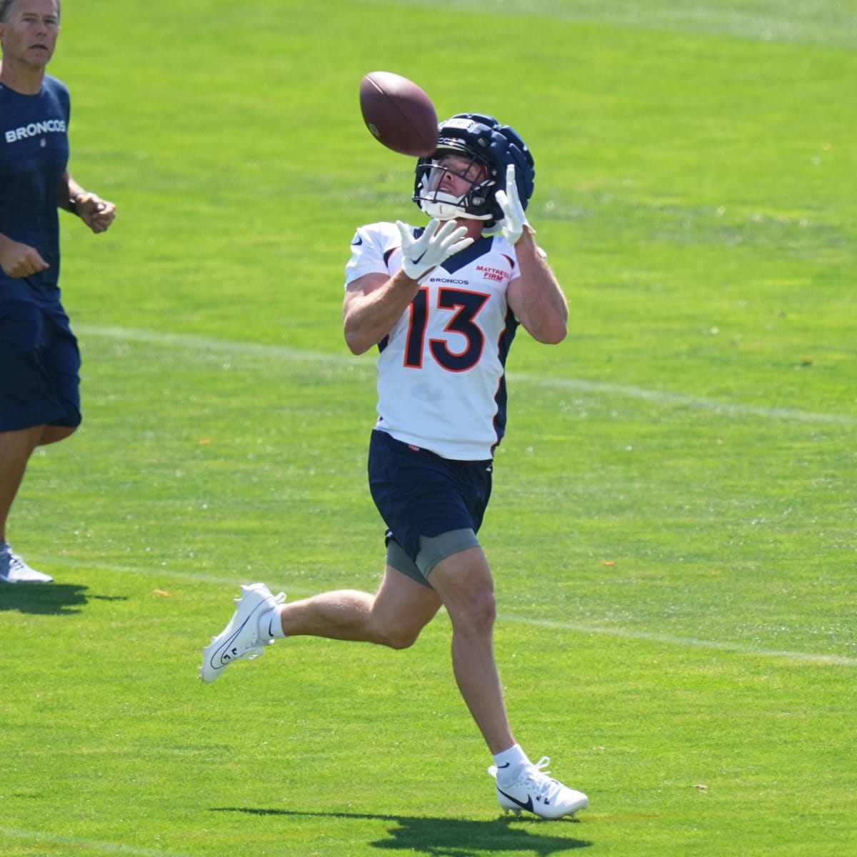 Denver Broncos linebacker Al Wilson stretches before taking part in the  opening day of the team's minicamp, Thursday, July 6, 2006, in southeast  Denver. The Broncos are running three days of minicamps