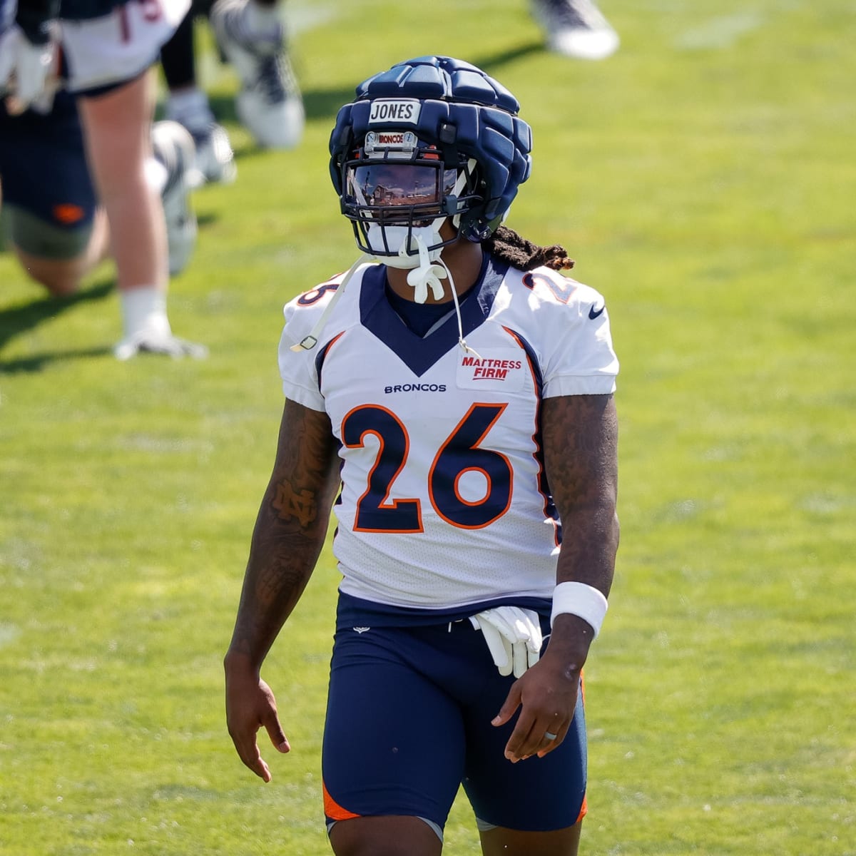 Tyler Badie of the Denver Broncos reacts after rushing for a