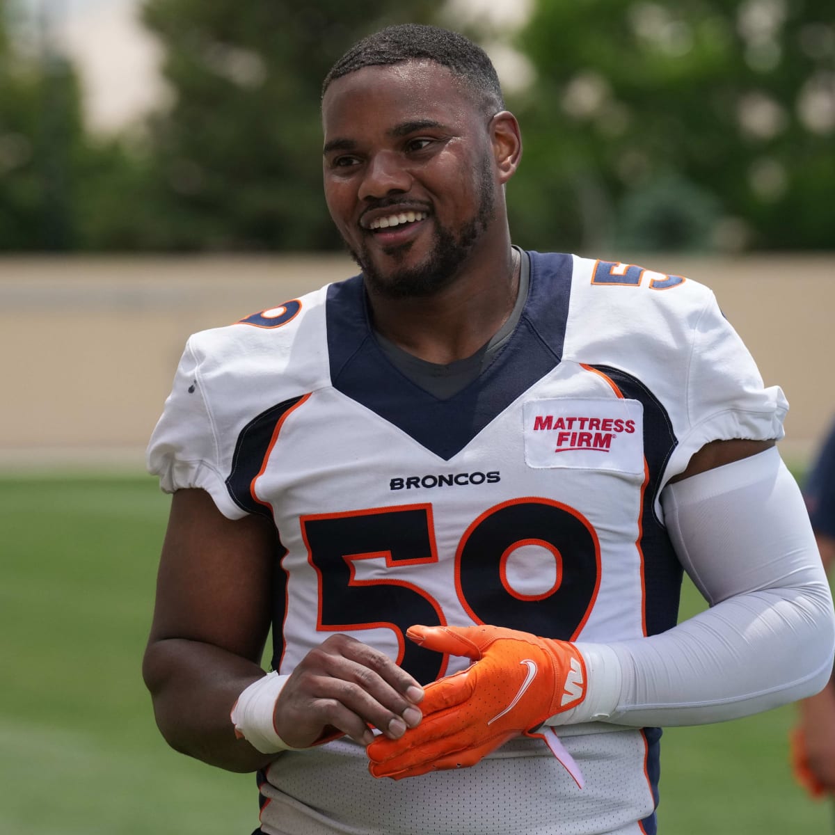 Denver Broncos defensive lineman Mike Purcell takes part in drills