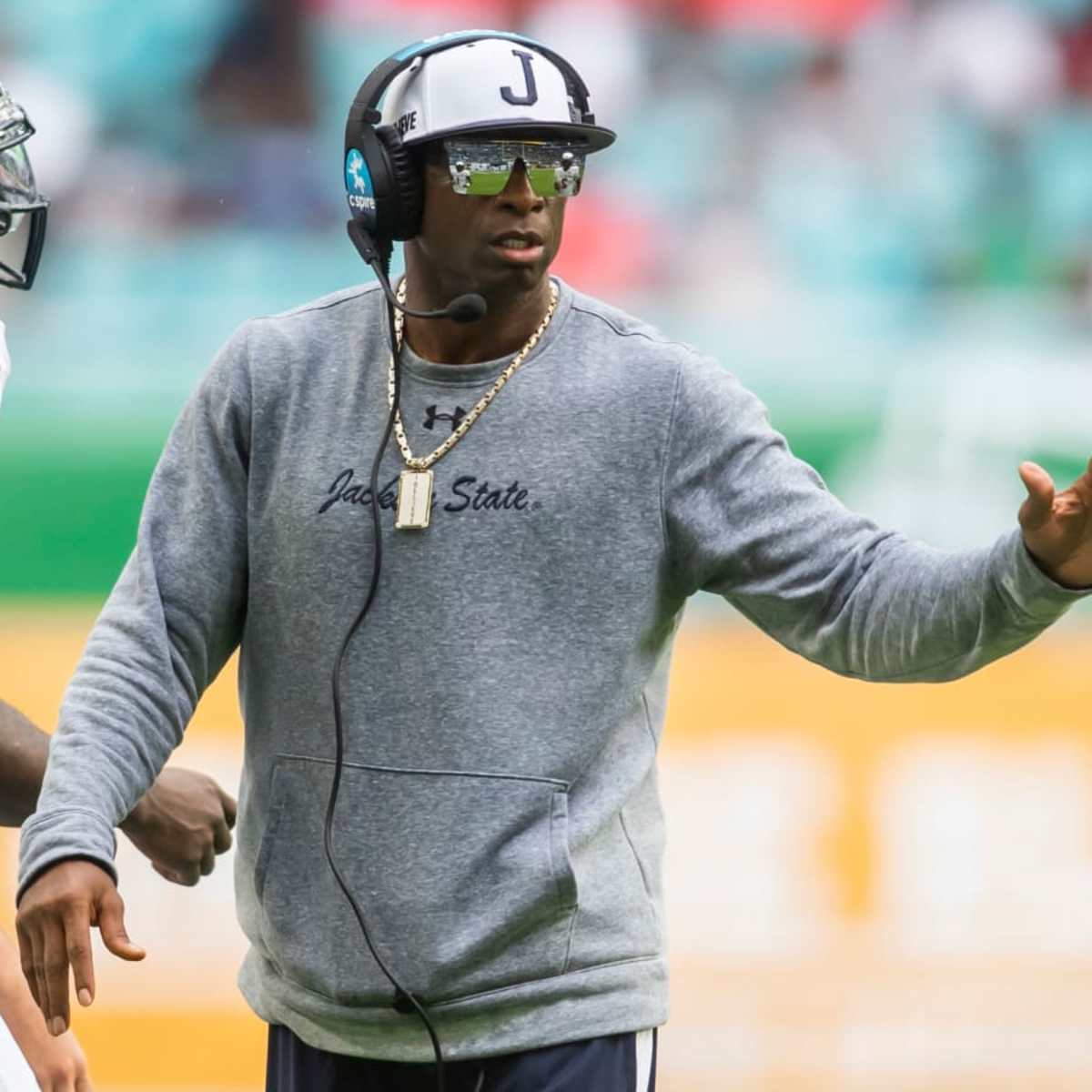 Cornerback Deion Sanders of the Dallas Cowboys prays while