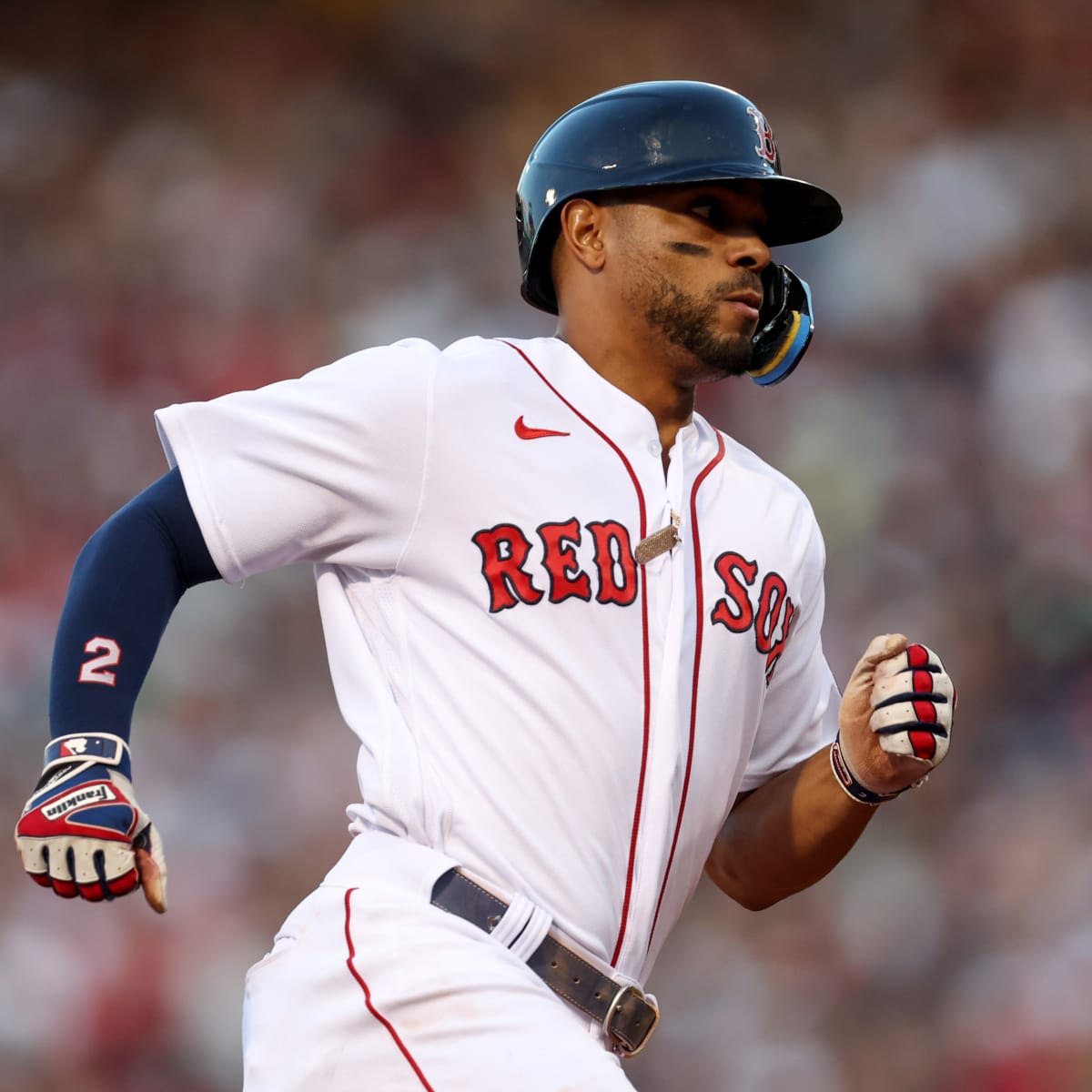 Xander Bogaerts of the Boston Red Sox warms up as he wears the Nike
