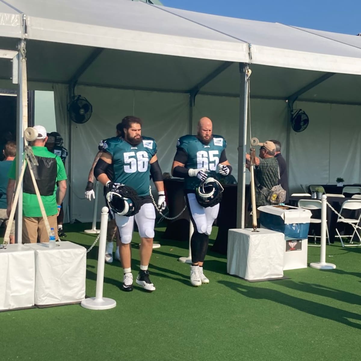 Philadelphia Eagles guard Isaac Seumalo (56) and center Landon Dickerson  (69) take part in drills at the Miami Dolphins' NFL football team's  practice facility, Thursday, Aug. 25, 2022, in Miami Gardens, Fla. (