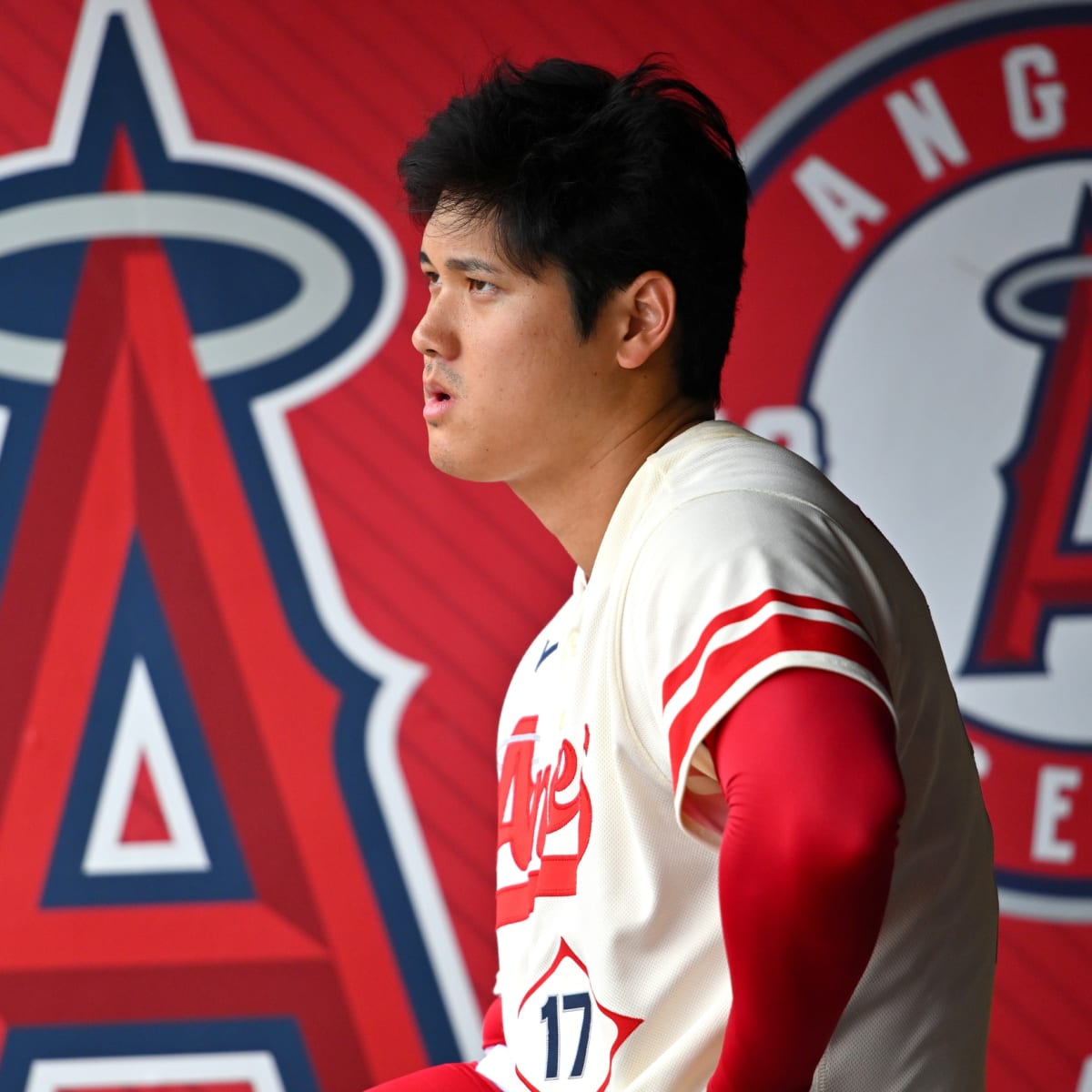 Shohei Ohtani of the Los Angeles Angels puts on a samurai warrior helmet,  the team's new home run celebration hat, after hitting a two-run homer in  the third inning of a baseball
