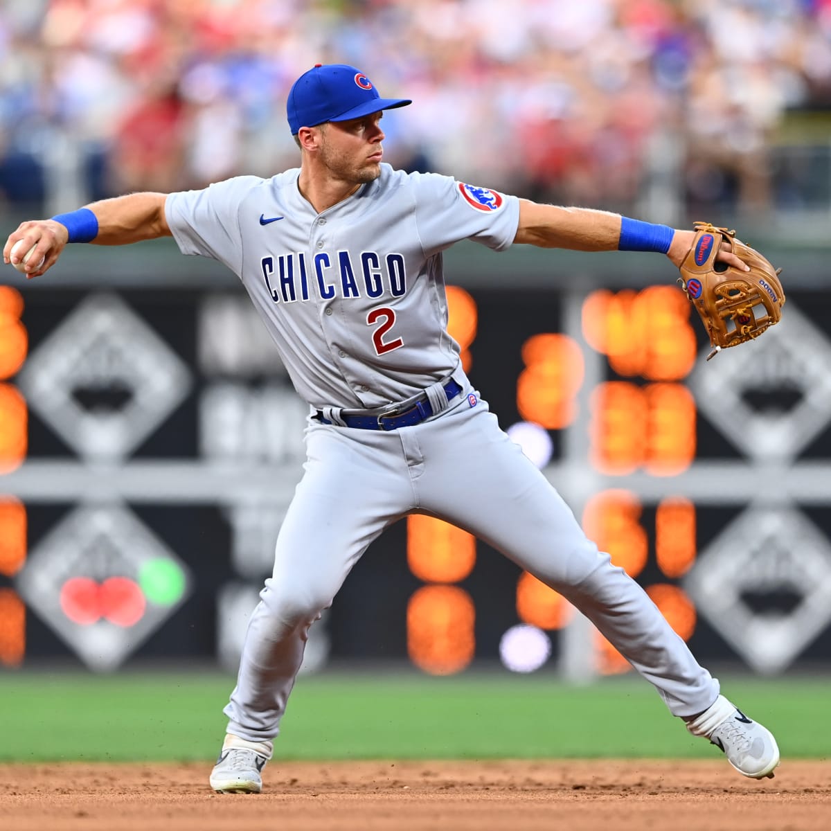TORONTO, ON - AUGUST 12: Chicago Cubs second baseman Nico Hoerner (2)  throws the ball to first base for the out during the MLB regular season  game between the Chicago Cubs and