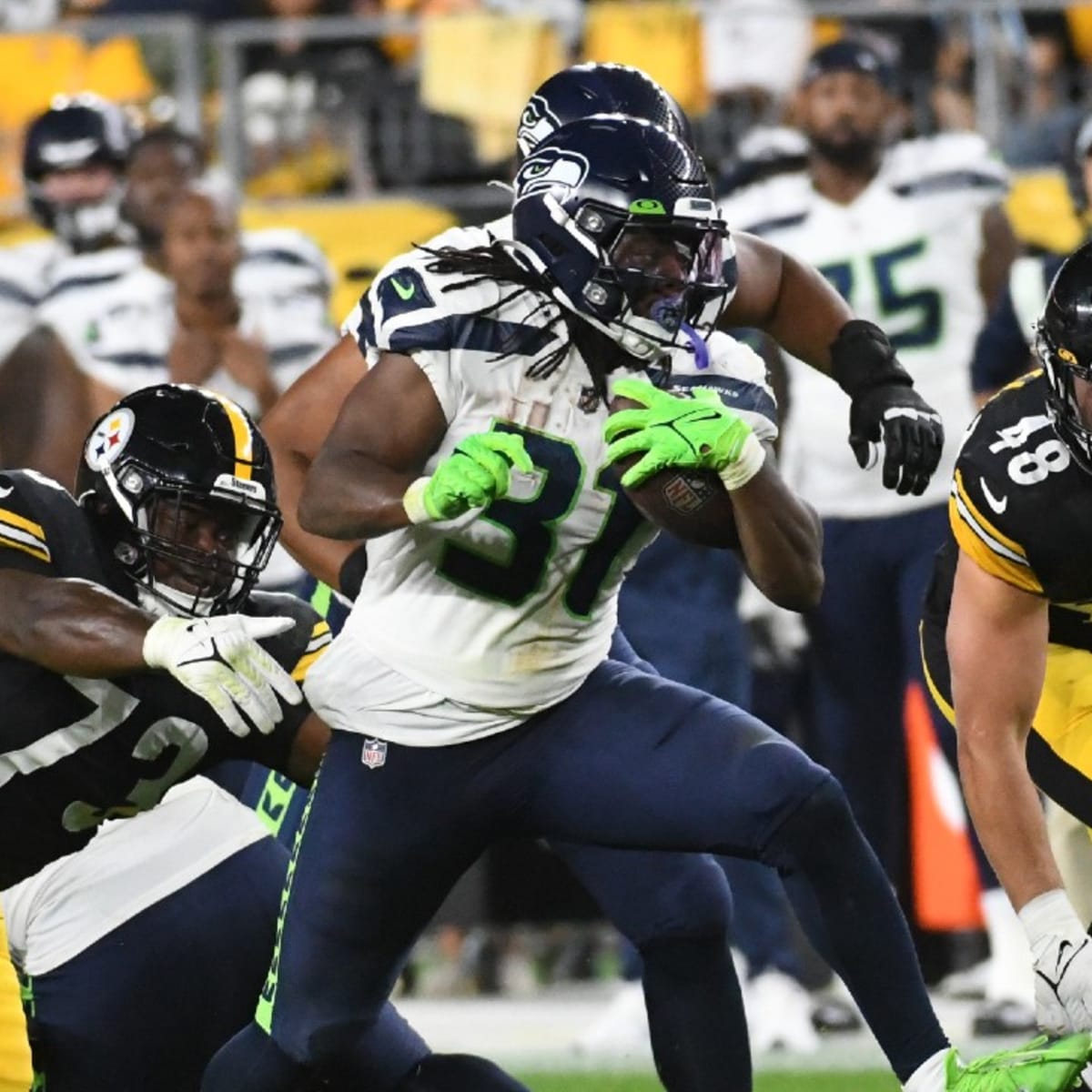 DeeJay Dallas of the Seattle Seahawks gestures to the fans during