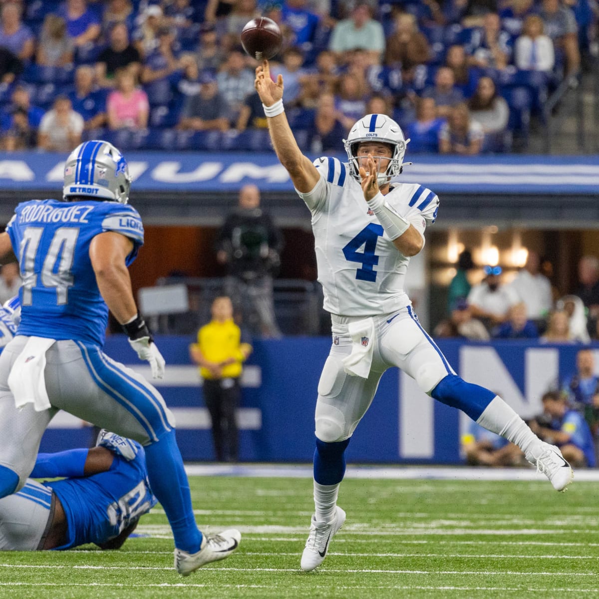 Detroit Lions offense huddles against Indianapolis Colts during an