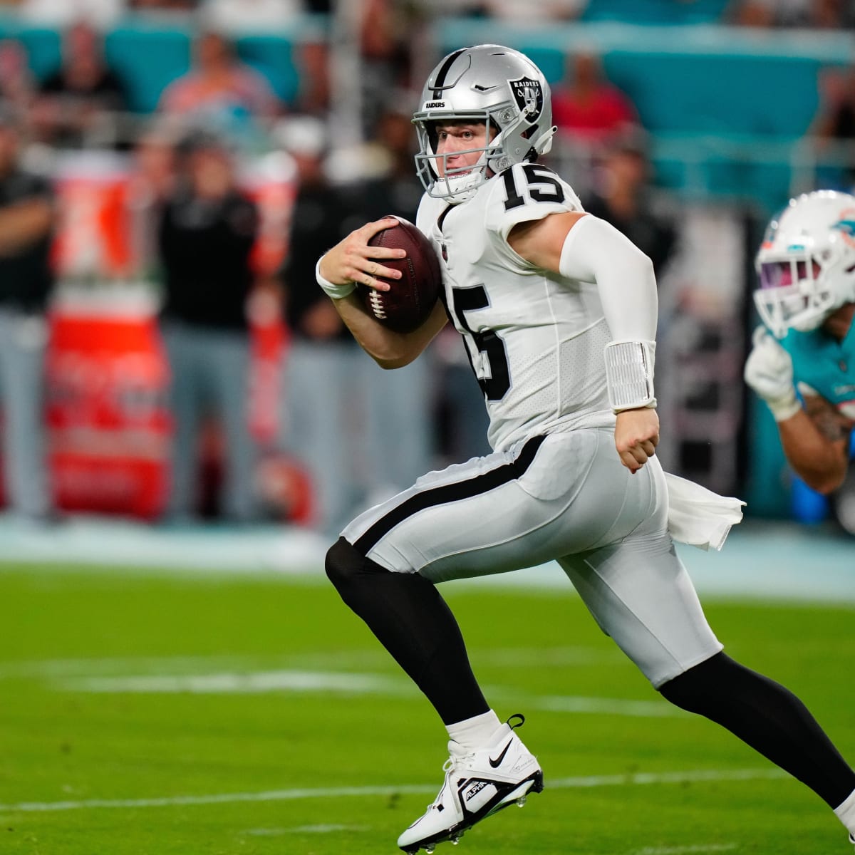 Las Vegas Raiders quarterback Chase Garbers (15) throws the ball on the  field before an NFL