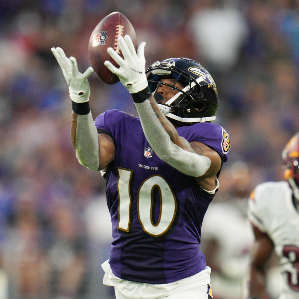 Washington Commanders WR Dyami Brown (2) catches a pass while being  defended by Baltimore Ravens DB Brandon Stephens (21) during a preseason  game at M&T Bank Stadium in Baltimore, Maryland on August