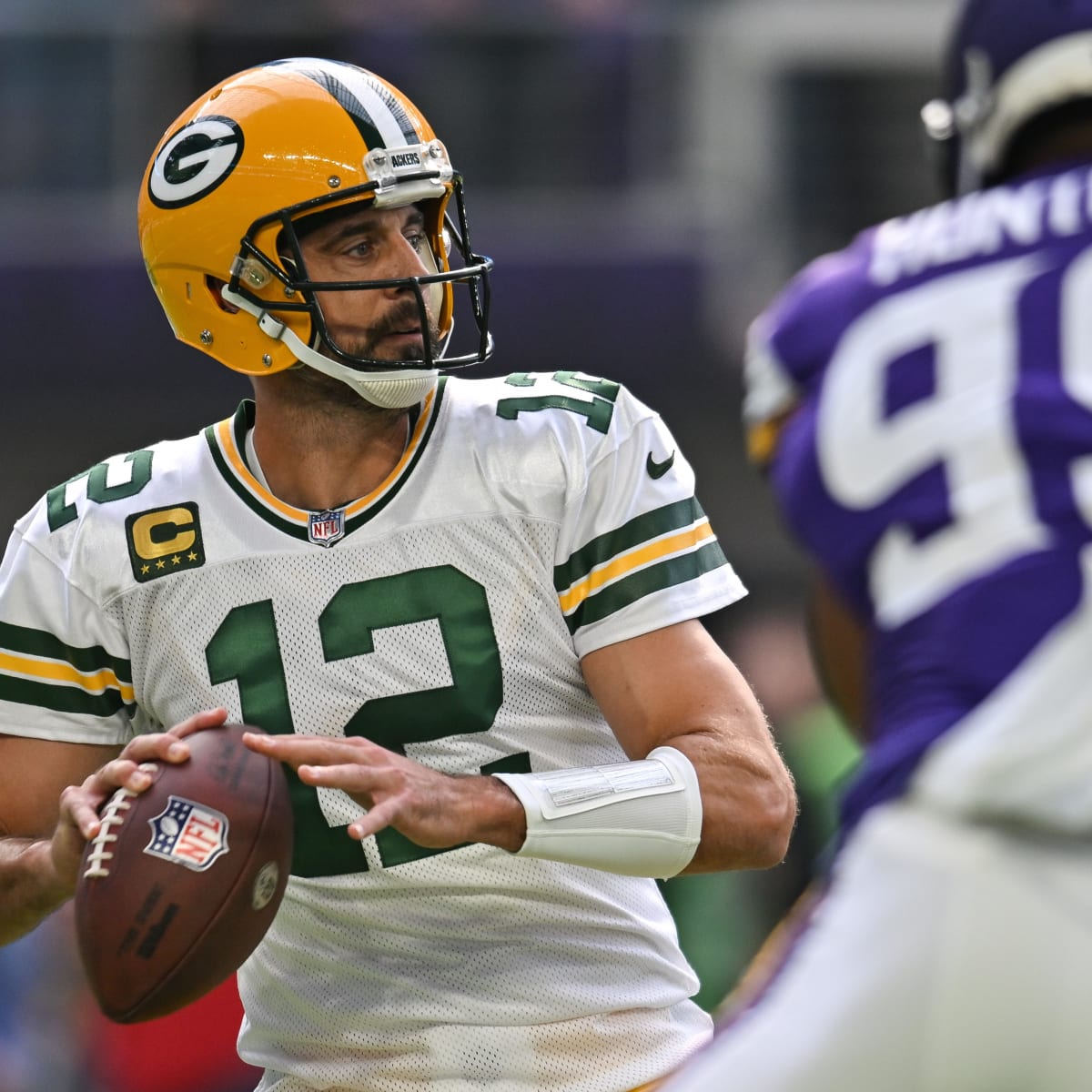 Rodgers breaks record, Packers grab four interceptions in