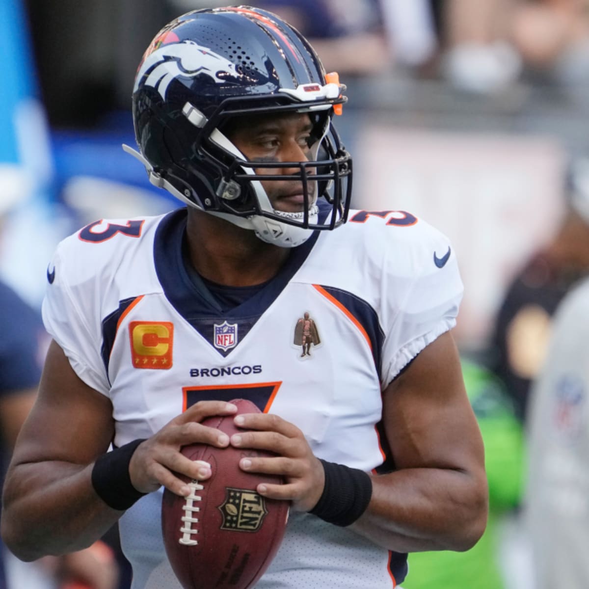 Denver Broncos quarterback Russell Wilson (3) greets Houston