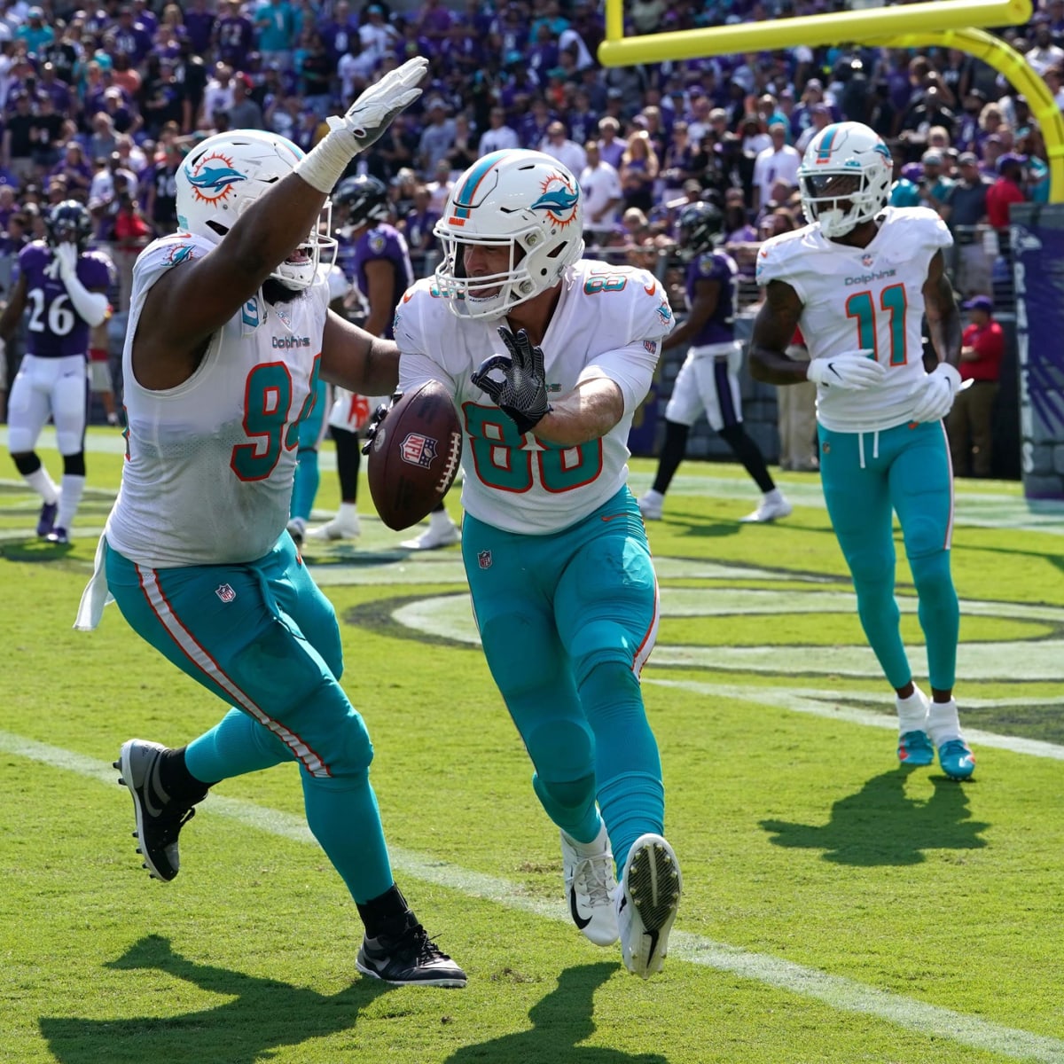 Miami Dolphins tight end Mike Gesicki (88) smiles as he warms up on the  field before the Dolphins take on the Los Angeles Chargers during an NFL  football game, Sunday, Nov. 15