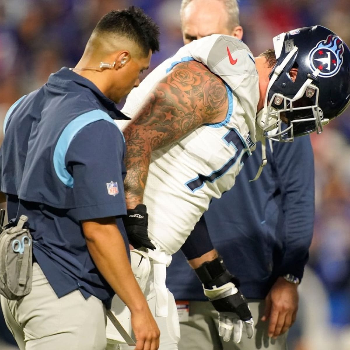 Tennessee Titans: Taylor Lewan Injured on Offense's First Play
