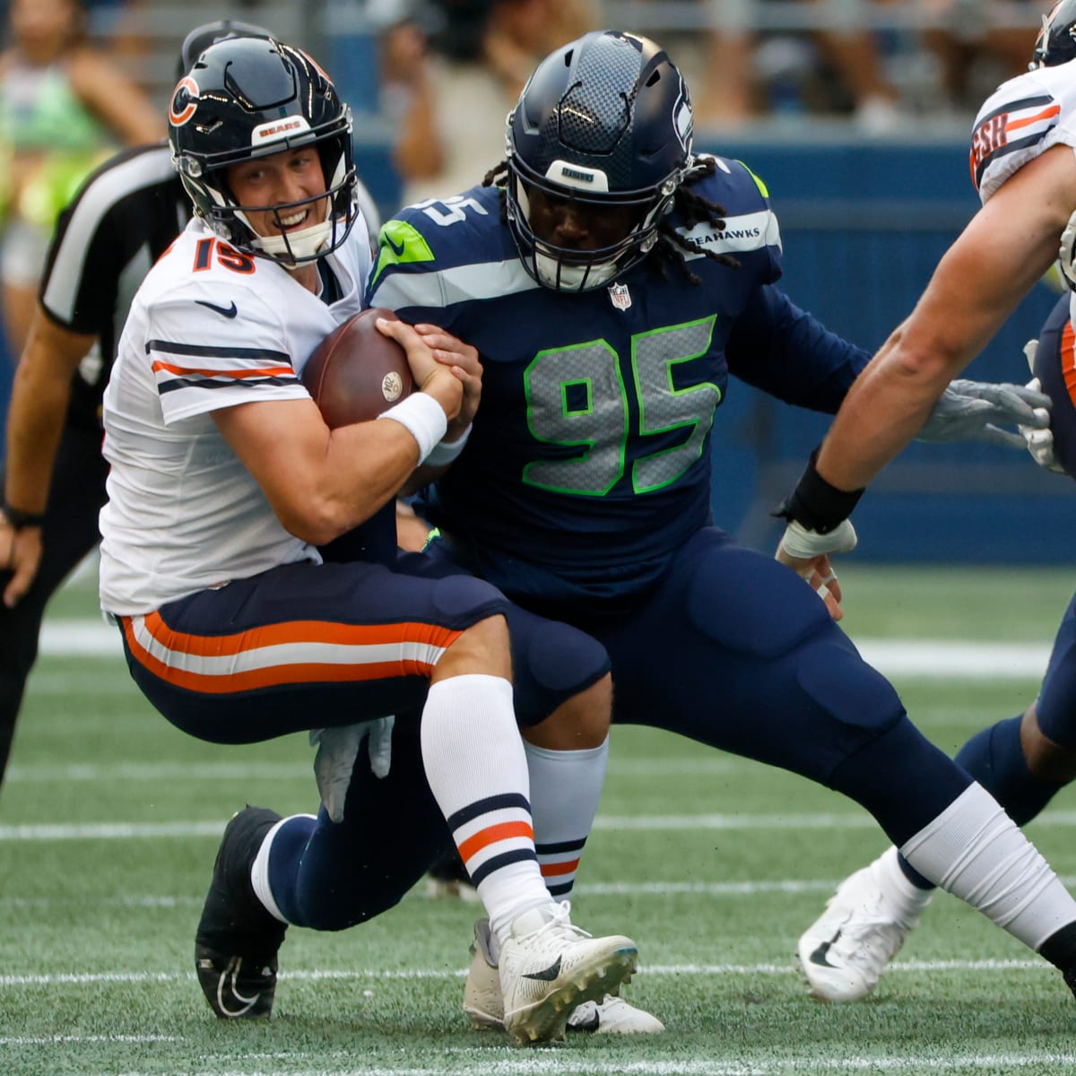 Seattle Seahawks defensive tackle Myles Adams (95) jogs off th