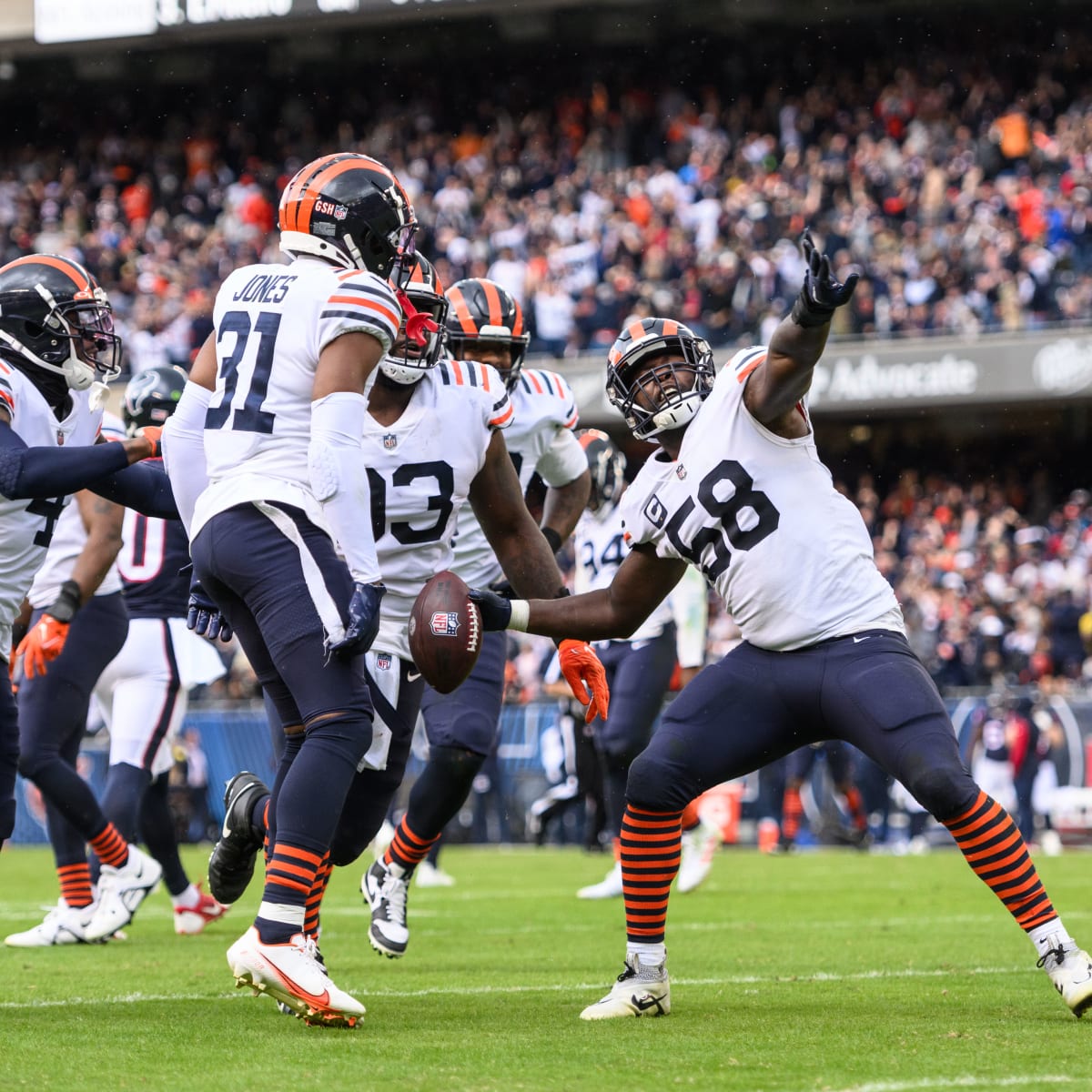 Chicago Bears safety Eddie Jackson (4) celebrates with teammates after  intercepting a pass in the end zone against the Houston Texans during the  first half of an NFL football game Sunday, Sept.