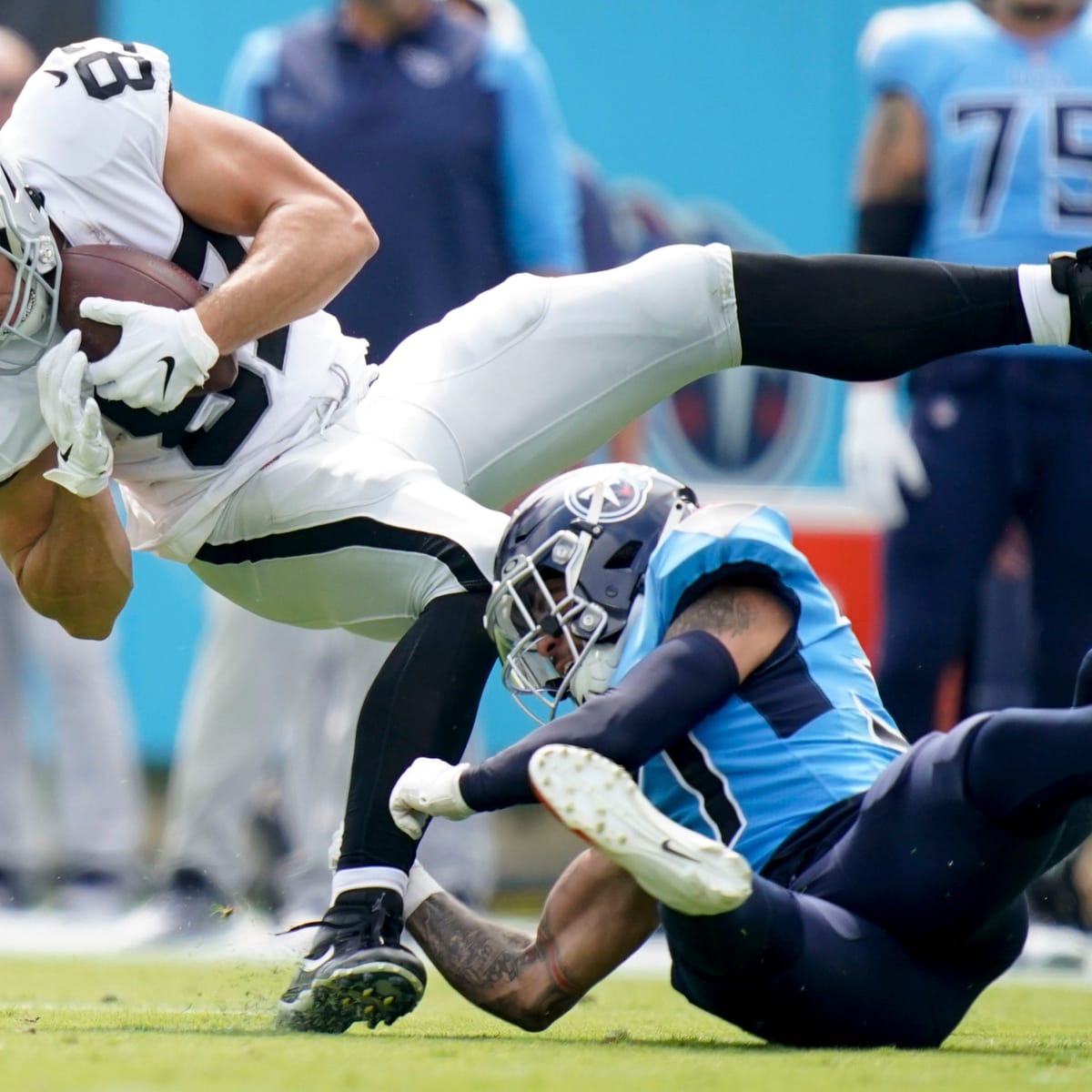 Las Vegas Raiders wide receiver Hunter Renfrow #13 is helped off the field  after suffering a bi …