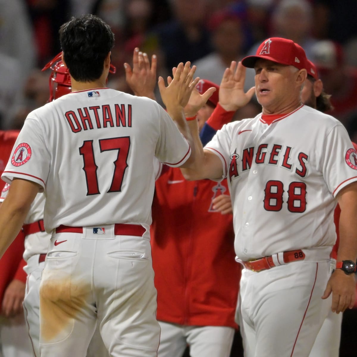 In Photos: Shohei Ohtani poses with manager Phil Nevin after receiving A.L.  Player of the Month honors