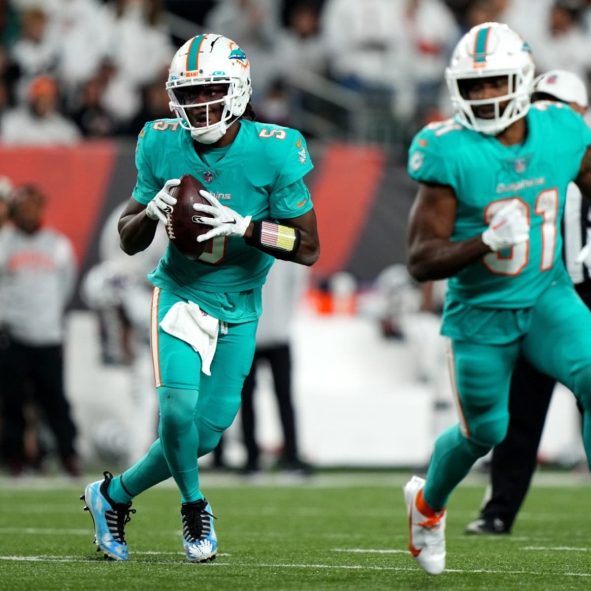 Miami Dolphins quarterback Teddy Bridgewater (5) is tackled by Las