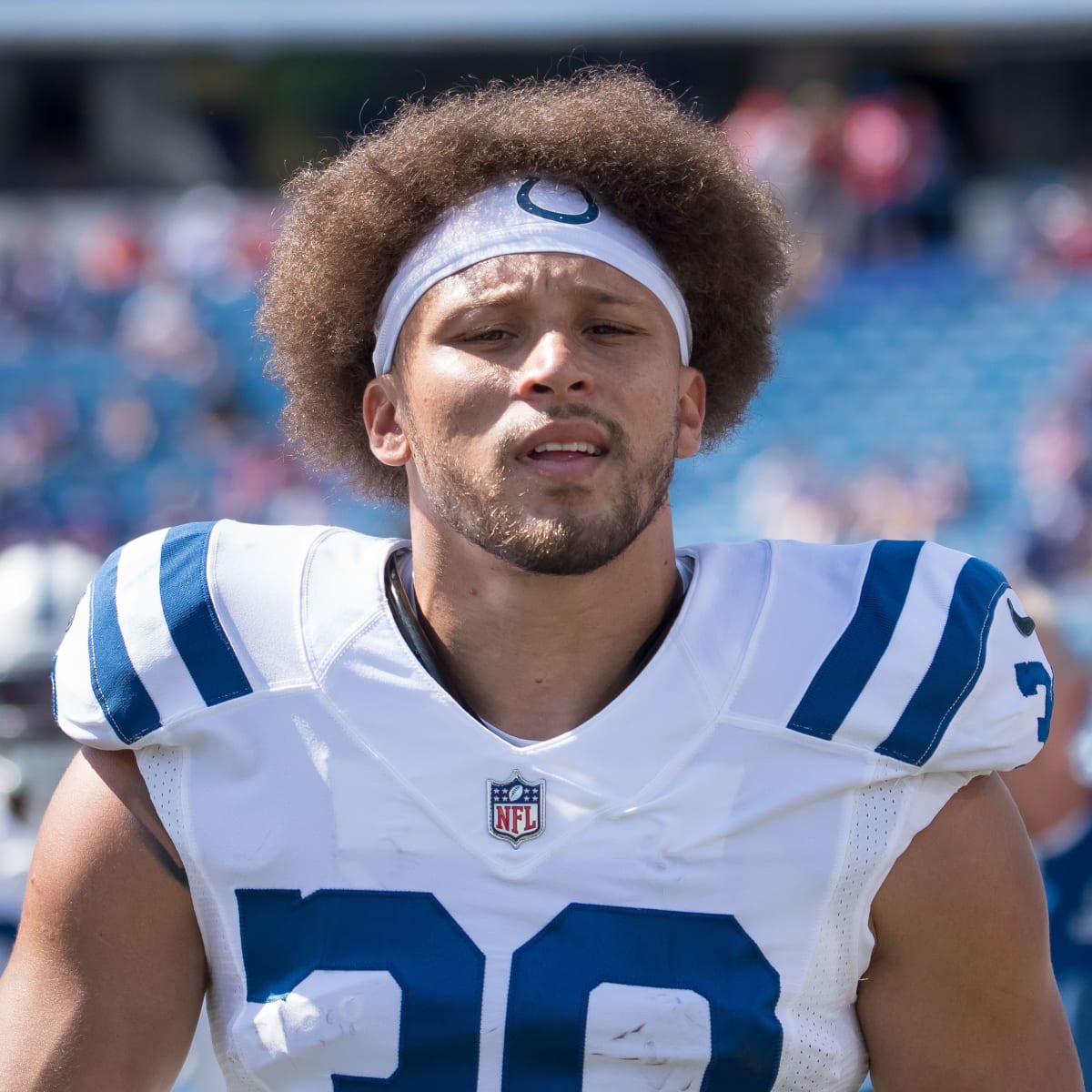 October 16, 2022, Indianapolis, Indiana, U.S: Indianapolis Colts running  back Phillip Lindsay (30) jumps to try to avoid the tackle by Jacksonville  Jaguars cornerback Darious Williams (31) during the game between the