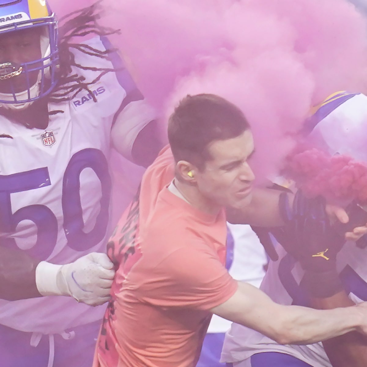 A fan ran on the field with a pink smoke bomb and Bobby Wagner