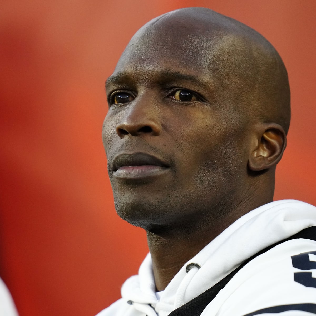 Chad Johnson visits Bengals training camp, leaps into Higgins' arms