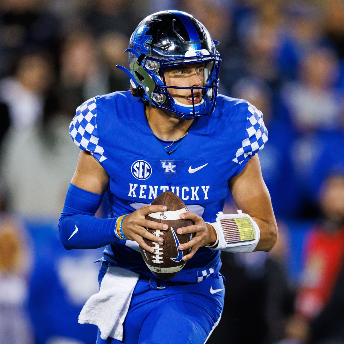 Kentucky quarterback Kaiya Sheron (12) hands the ball off during the second  half of an NCAA college football game against Youngstown State in  Lexington, Ky., Saturday, Sept. 17, 2022. (AP Photo/Michael Clubb