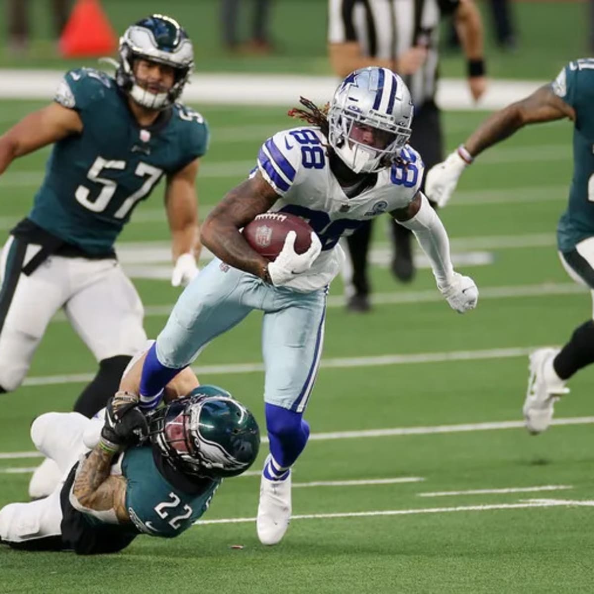 Dallas Cowboys wide receiver CeeDee Lamb slips Arizona Cardinals