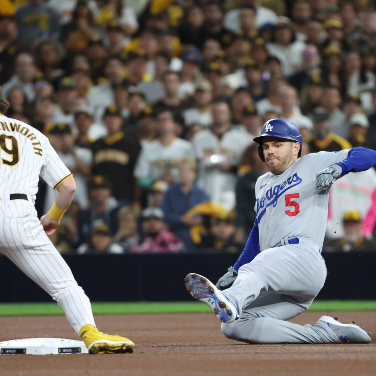 Injury-plagued Dodgers keeping close in bid to repeat title