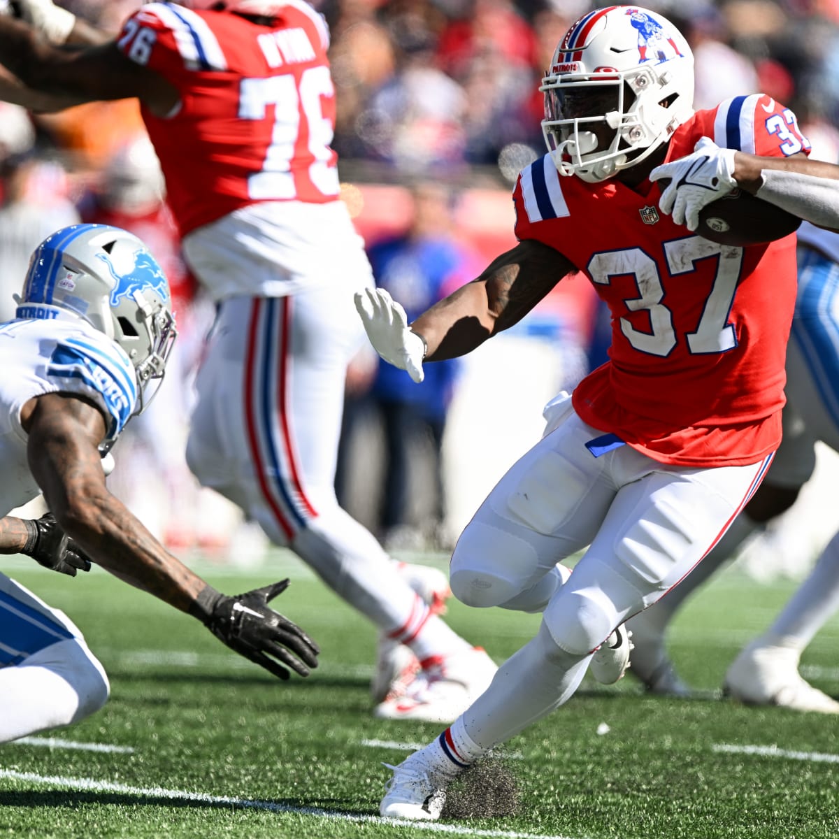 New England Patriots running back Damien Harris (37) is brought