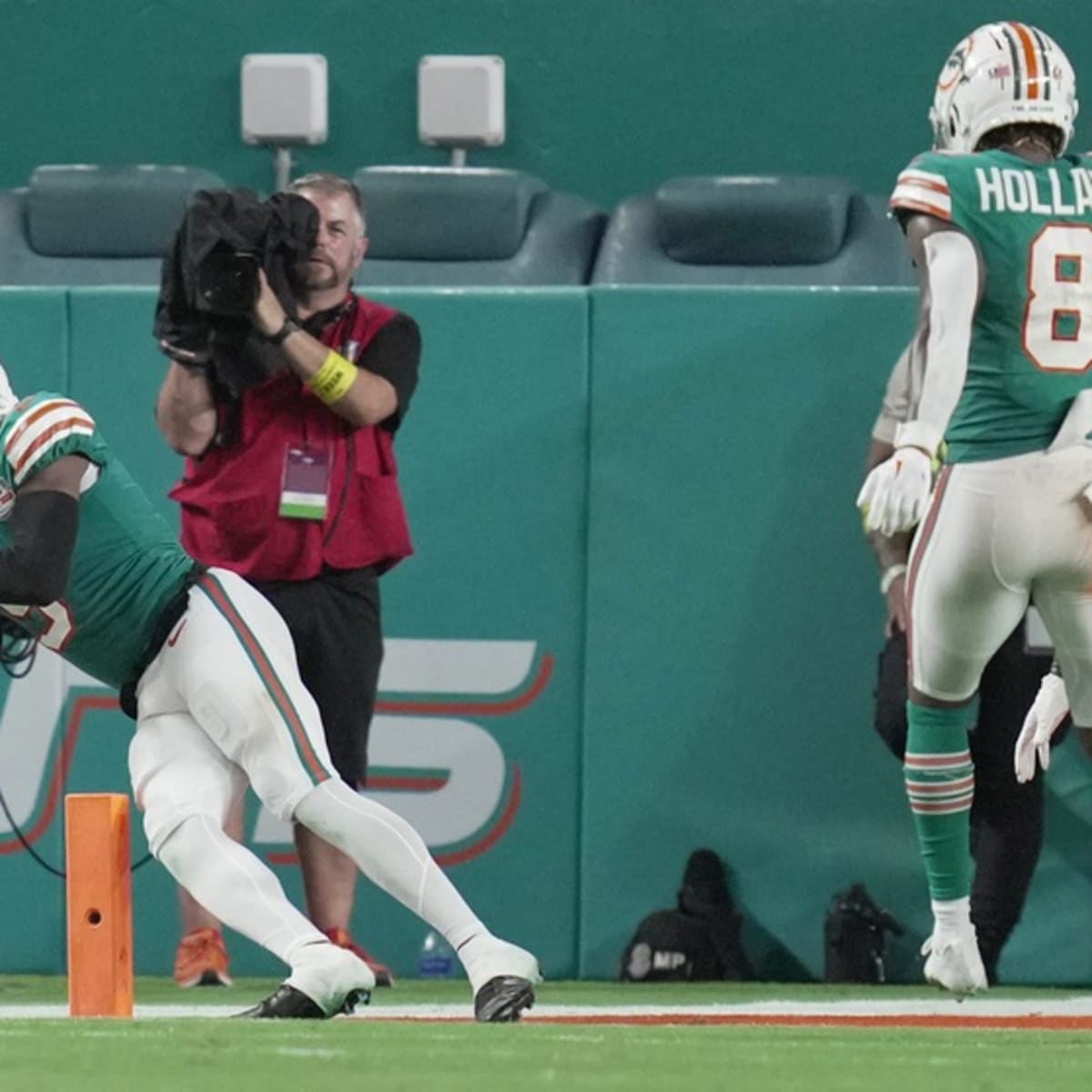 Miami Dolphins running back Ricky Williams checks play September 7