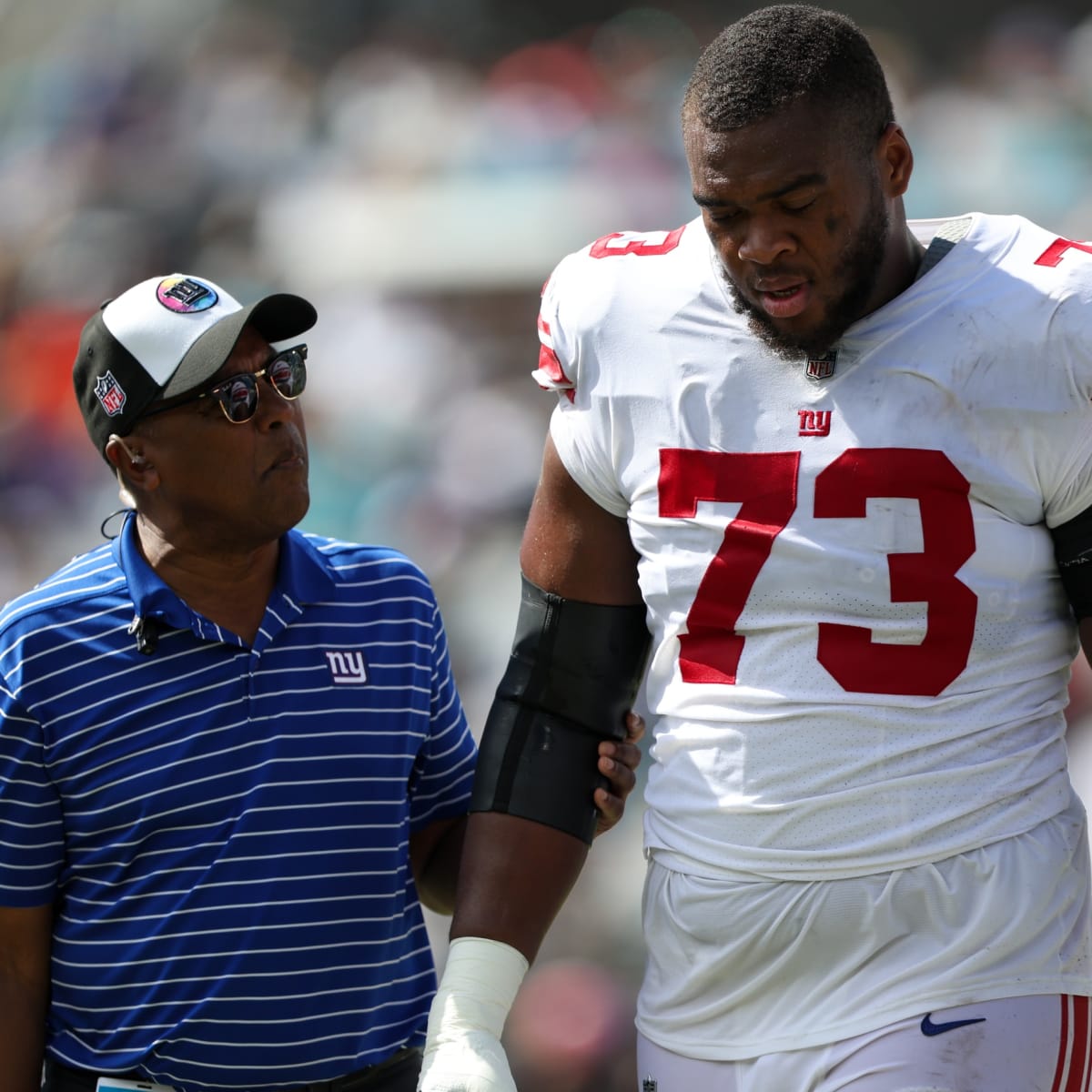 New York Giants tackle Evan Neal #73 walks off the field after