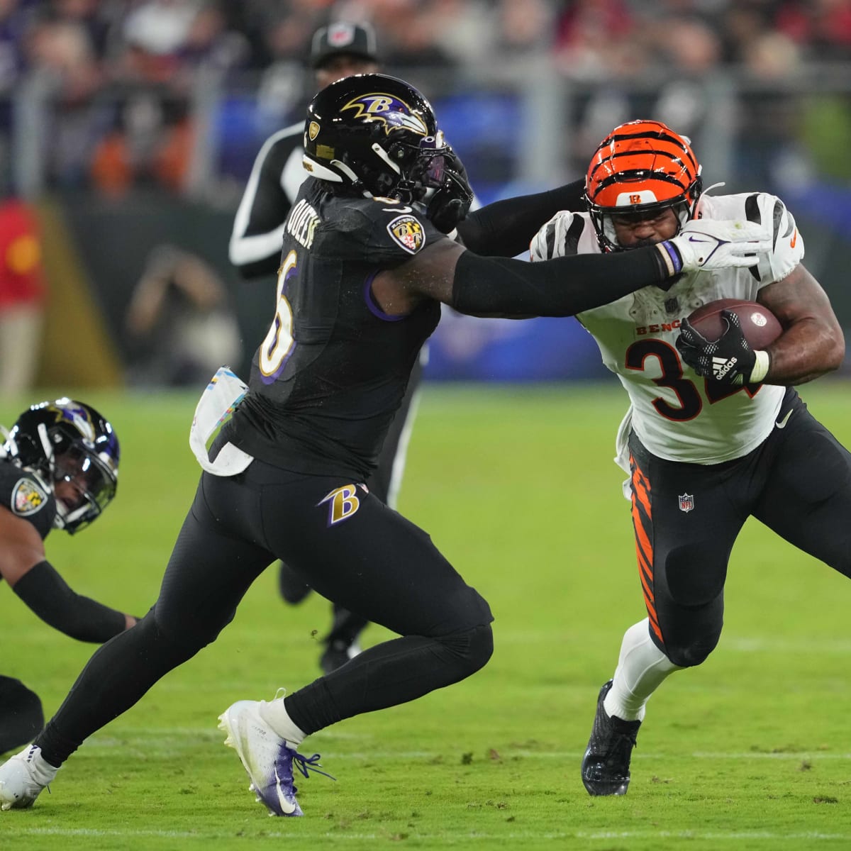 Baltimore Ravens linebacker Patrick Queen (6) greets quarterback