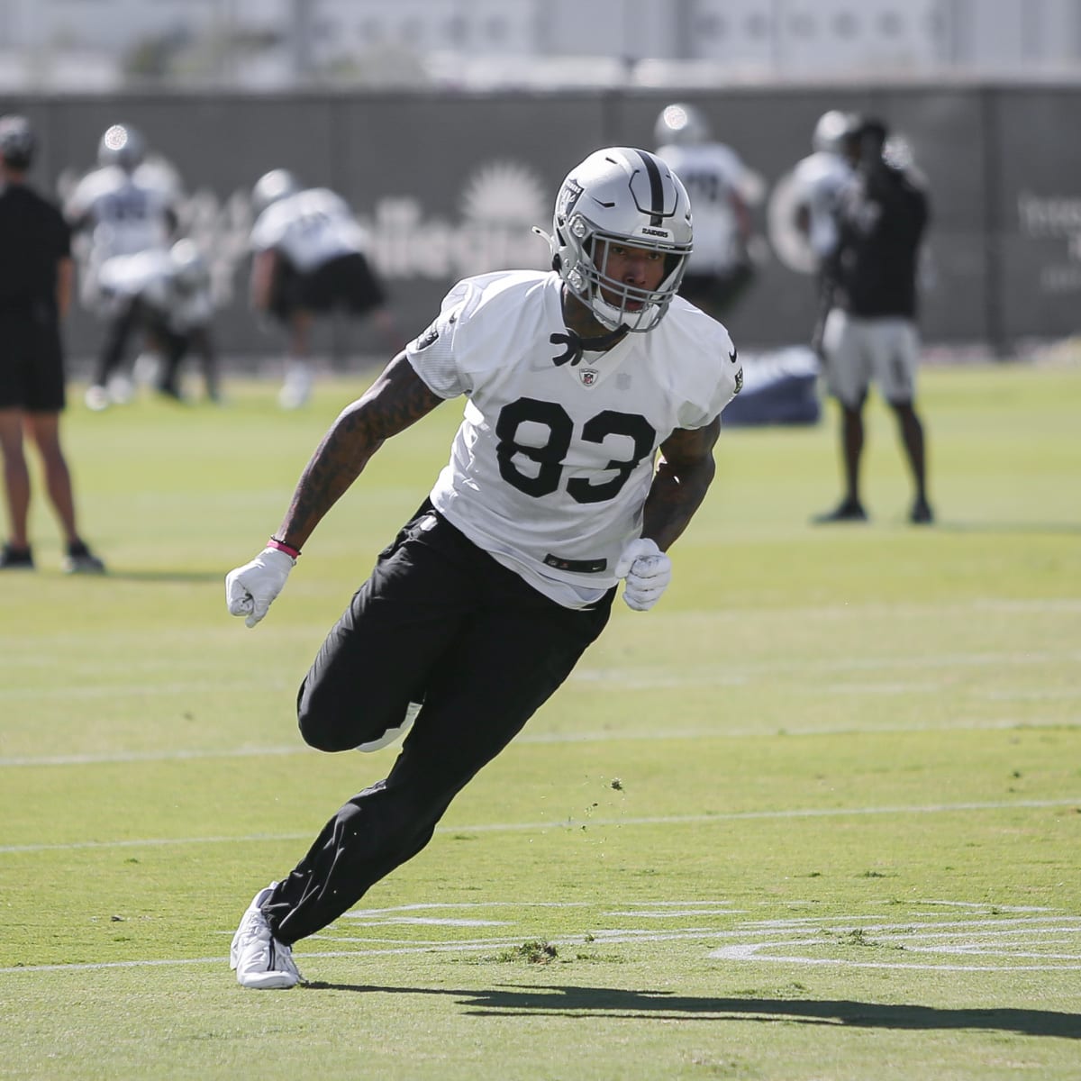 Raiders tight end Darren Waller (83) pushed out of bound by